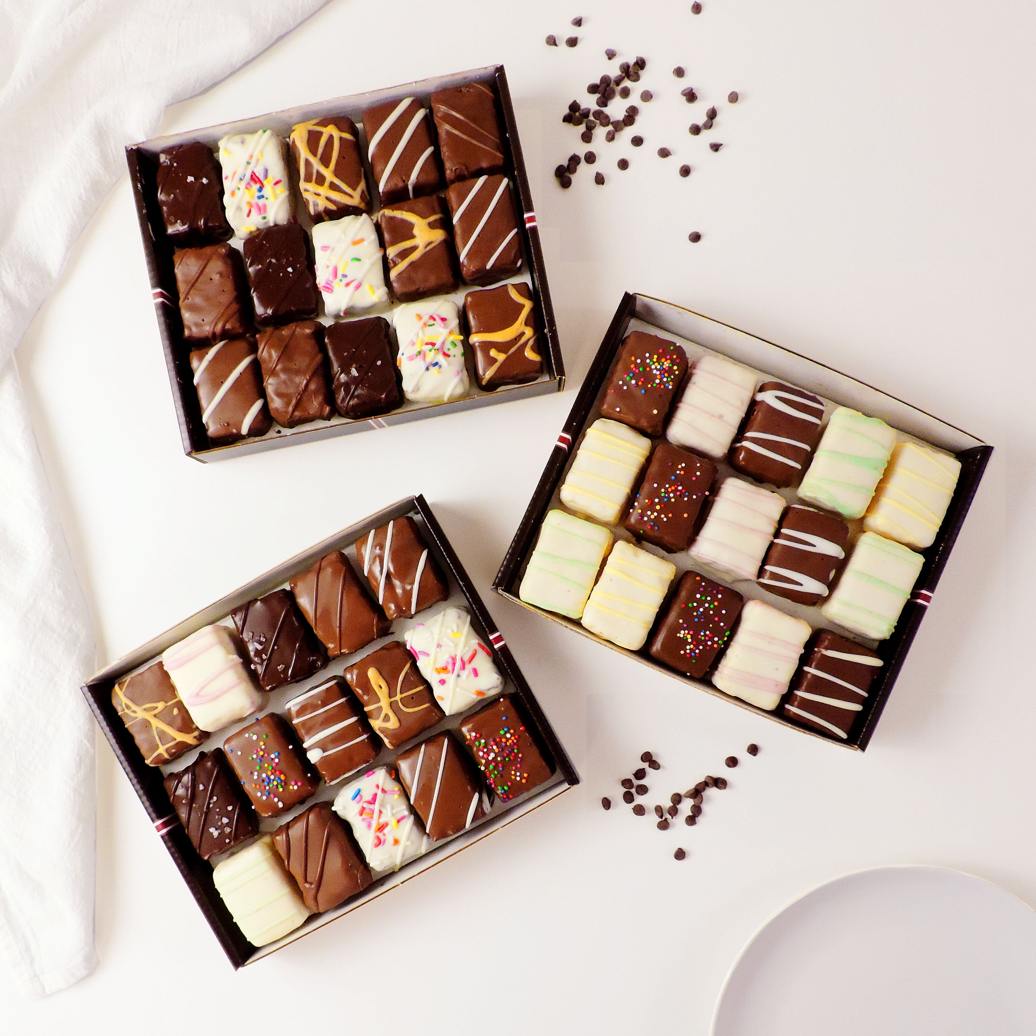 45-piece dessert gift box with assorted chocolate-covered brownie bites, cake bites, and rainbow cookie bites. Ready-to-share assortment for birthdays, parties, corporate gifts, holidays, and dessert tables.