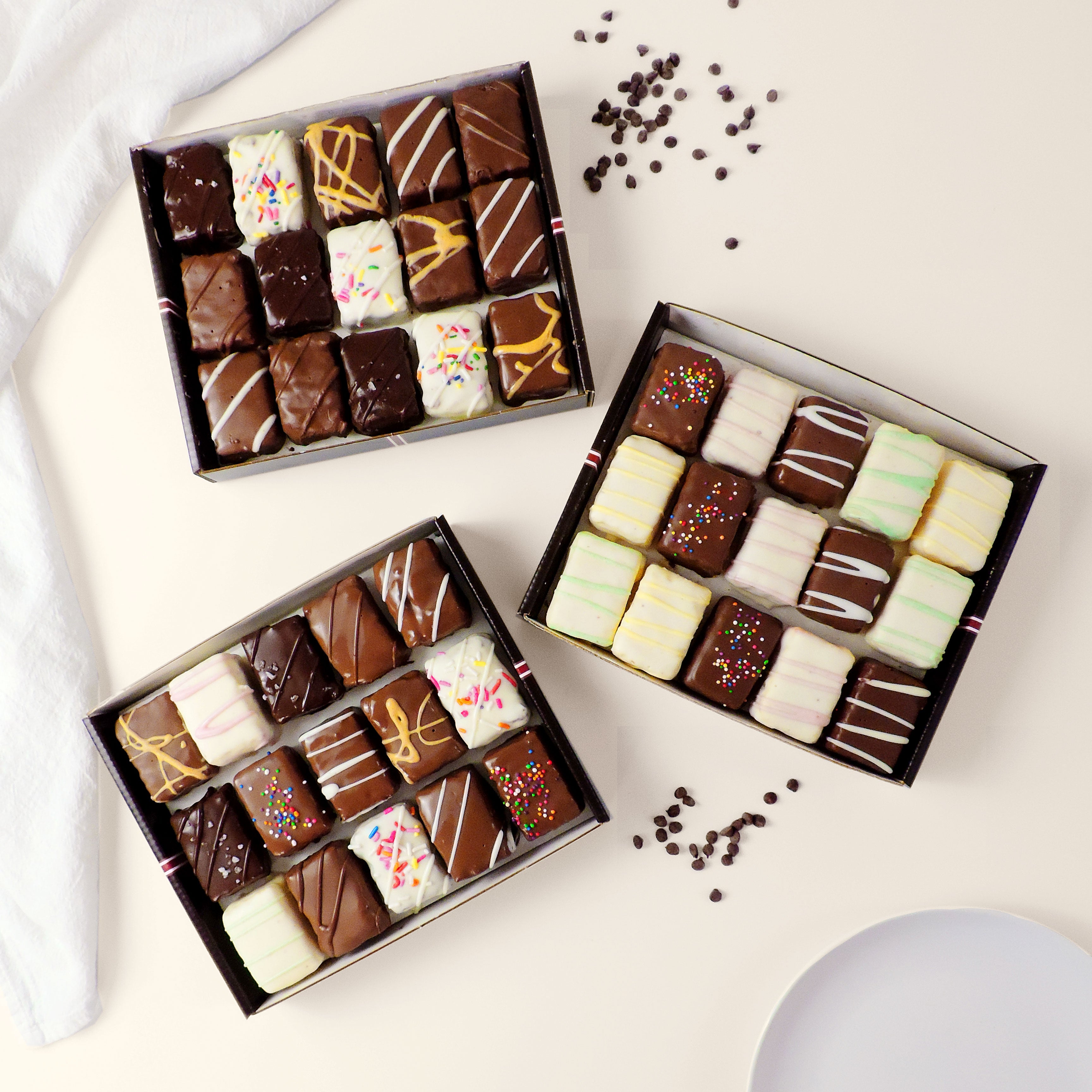 45-piece dessert gift box with assorted chocolate-covered brownie bites, cake bites, and rainbow cookie bites. Ready-to-share assortment for birthdays, parties, corporate gifts, holidays, and dessert tables.