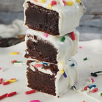 Rich, fudgy brownie bites hand-dipped in creamy white chocolate for a smooth, sweet finish. A handcrafted bite-sized treat that's perfect for gifting, celebrations, or enjoying one at a time.